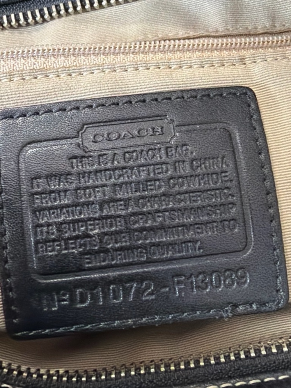 Coach black leather interior patch with tan lining
